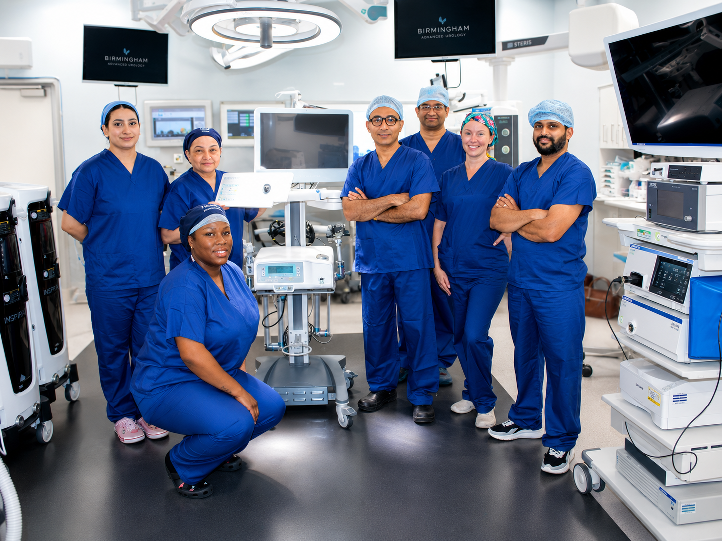Mr Syed Ali Shahzad with a robotic theatre team and robotic surgery system