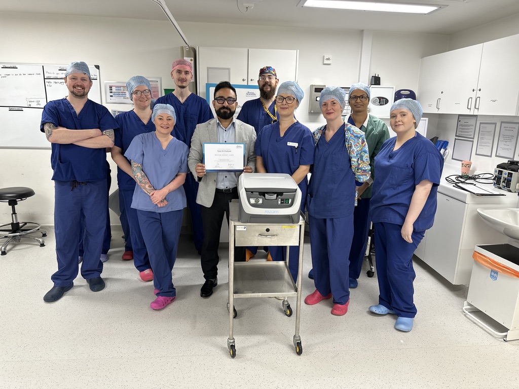 Mr Syed Ali Shahzad with a clinical theatre team