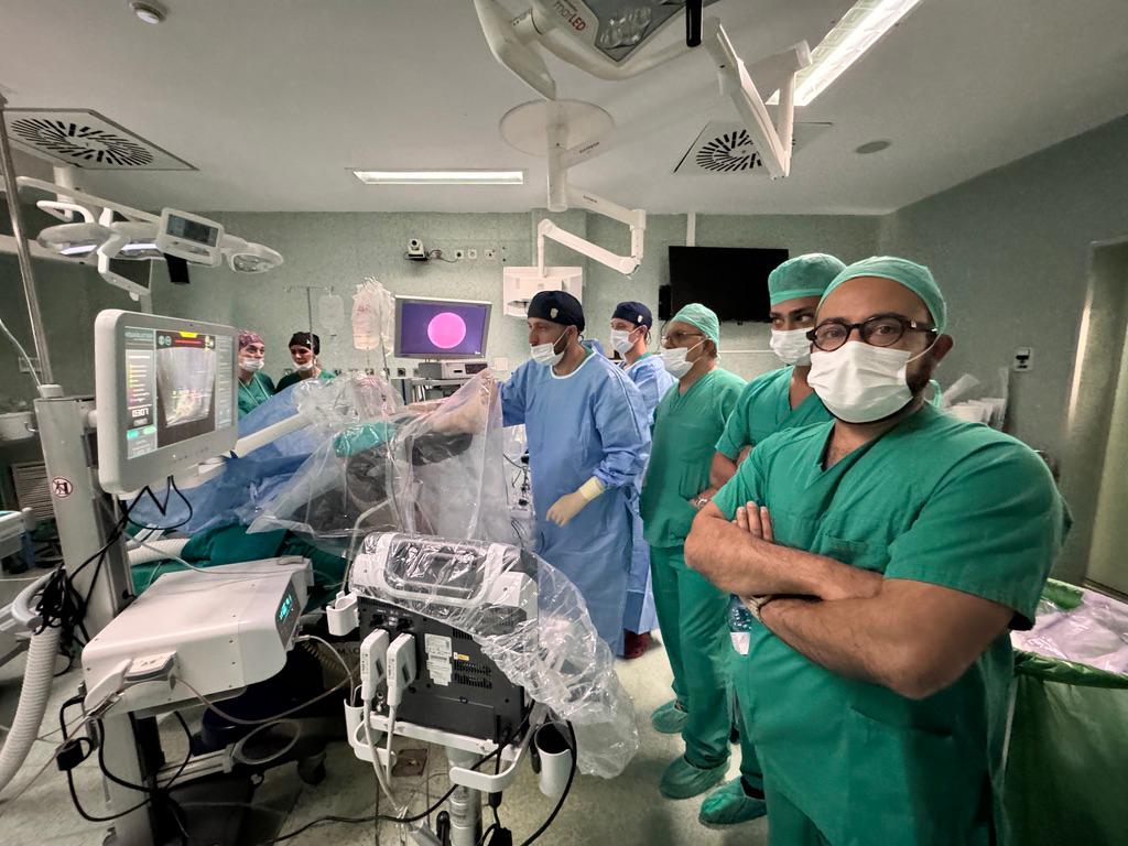 Mr Syed Ali Shahzad with a robotic theatre team in an operating theatre