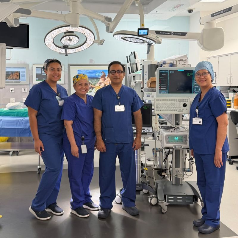 Mr Syed Ali Shahzad with the theatre team celebrating one year of Aquablation at The Harborne Hospital