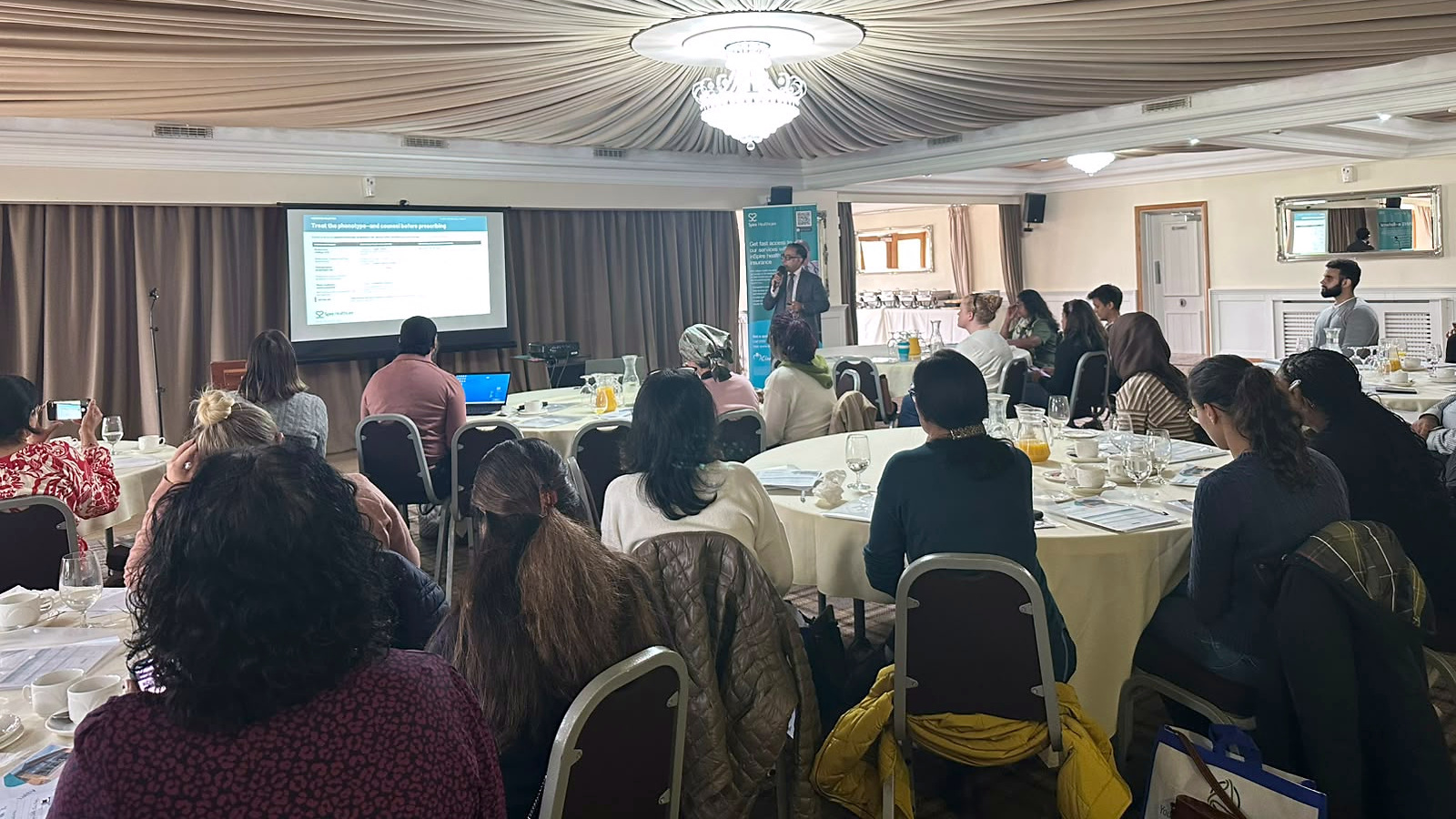 Mr Shahzad presenting to GPs at a urology education event